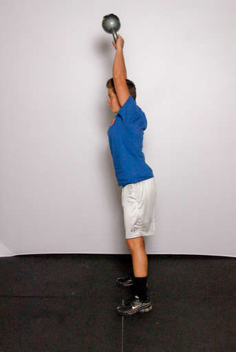 Straighten your hips, stand up and swing your arms up to lift the weight over your head. The power for the lift should come almost completely from the hip extension. Your quads and arms should not be doing much work.
