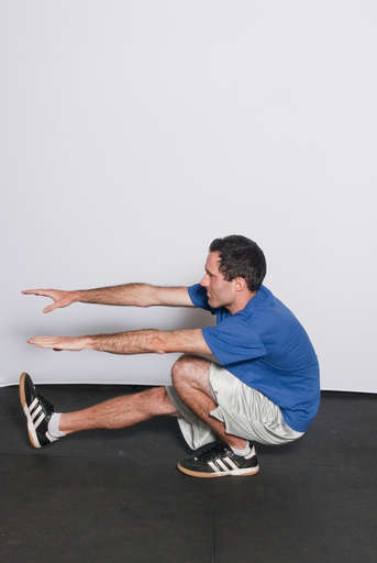 Continue to lower your body until your thighs are parallel to the floor.
