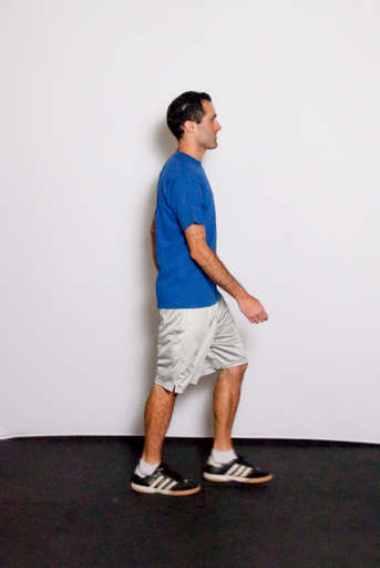 Take a step forward with one leg landing on the heel of your foot.
