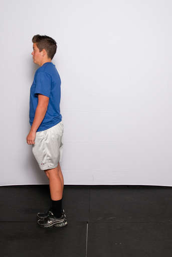 Extend your front leg to raise your body back to a standing position.