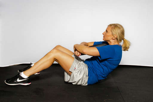 Lift your upper body off the floor by contracting your abdominal muscles. 
