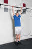 Grasp the pull up bar with an overhead grip, with your hands over the bar and approximately shoulder width apart. Hang from the pull up bar, so that your arms are completely straight.