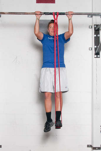 Bend your elbows and pull your chest up towards the bar.