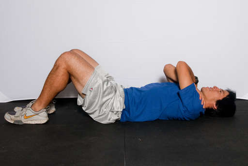 Lower your body back down to the floor, keeping your abdominal muscles contracted for a controlled descent.