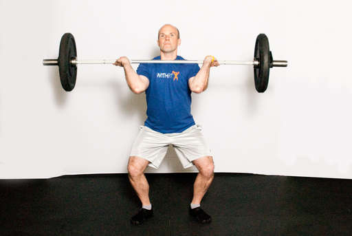 Extend your legs and hips to explosively raise your body to the standing position.