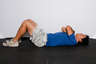 Lie flat on your back with your knees bent and feet flat on the floor. Cross your arms across your chest.