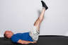 Lower your legs back down in a slow and controlled manner.
