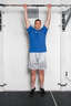 Grasp the pull up bar with an overhead grip, with your hands over the bar and approximately shoulder width apart. Hang from the bar with your arms completely straight.