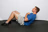 Lift your upper body off the floor by contracting your abdominal muscles. 

