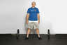 Stand in a wide stance, with your feet wider that shoulder width and toes angled slightly outwards.
