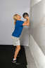 Explosively extend your arms and legs, bringing your body to a standing position and throwing the ball at your target.